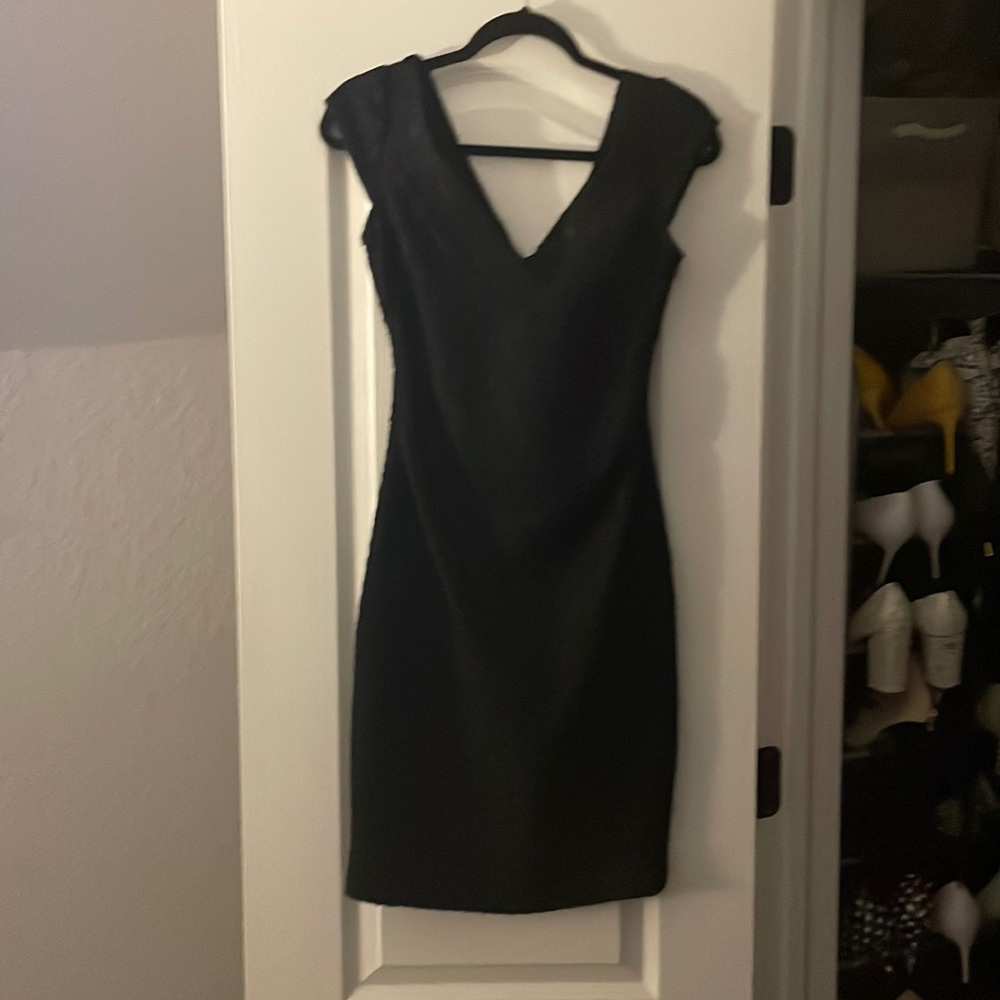 Textured tight fitting cocktail dress.